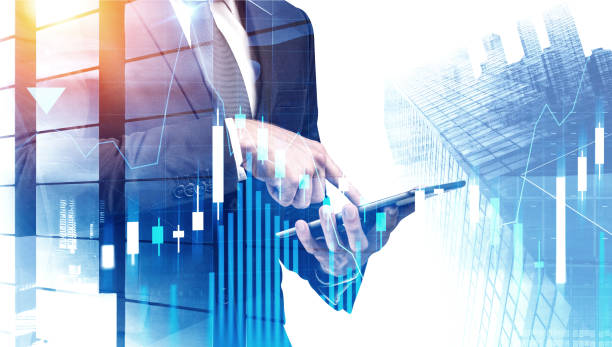 istock Businessman with tablet in city, forex graph 1192644385