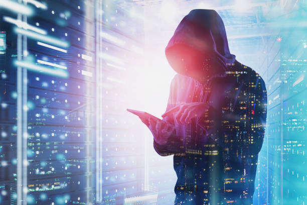 Hacker with tablet in data center Young hacker with tablet working in data center with double exposure of night city. Concept of identity theft and cybersecurity. Toned image identity theft photos stock pictures, royalty-free photos & images