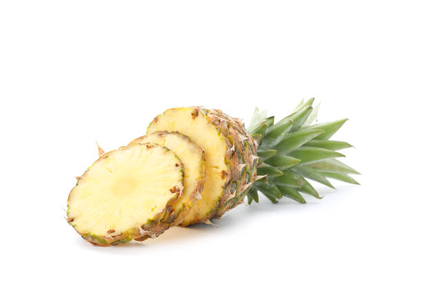 istock Cutted pineapple and slices isolated on white background 1192644448