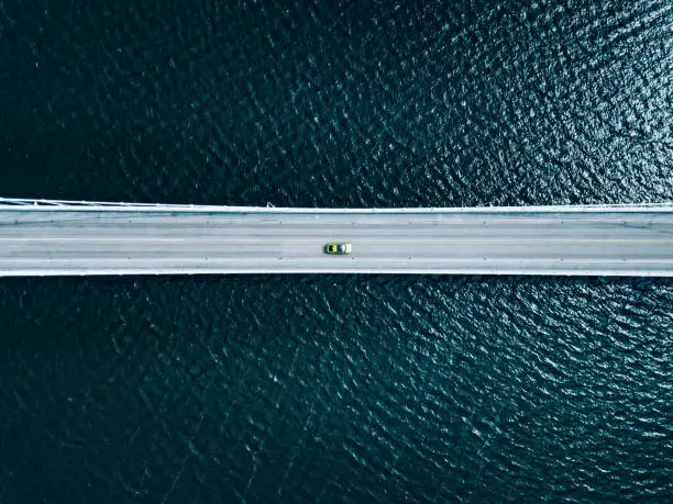 Photo of Aerial view of bridge road with cars over lake or sea in Finland