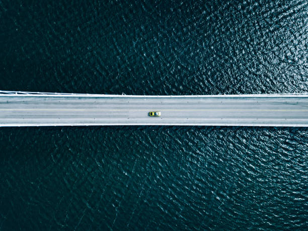 aerial view of bridge road with cars over lake or sea in finland - blue fin imagens e fotografias de stock