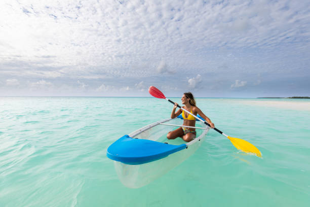 istock Young happy woman having fun while paddling at sea. 1192647761