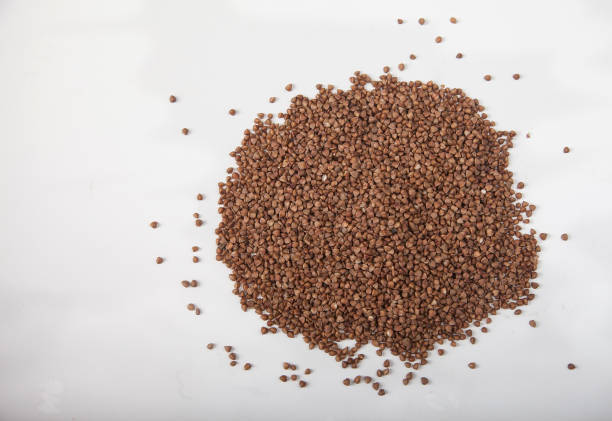 istock Buckwheat seeds closeup isolated on white background. Copy spaes. 1192647856