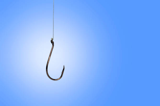 istock fish hook twist on a cord, blue background 1192649276