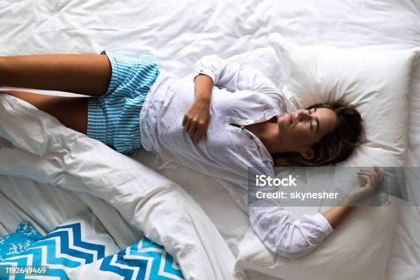 Above View Of Relaxed Woman Sleeping In Bed Stock Photo - Download Image Now - Adult, Adults Only, Beautiful Woman