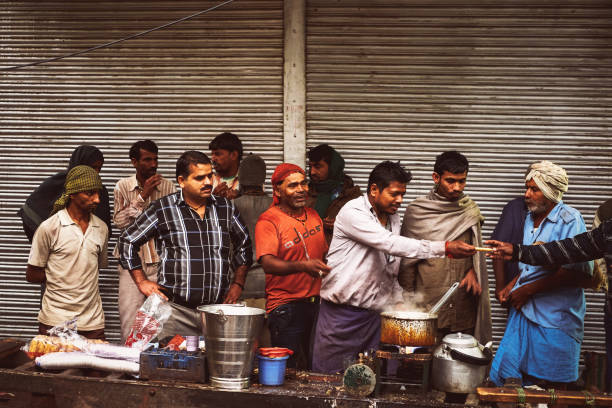 a group of food vendors at the time of the sale in new delhi, india - consumerism indian ethnicity india delhi imagens e fotografias de stock