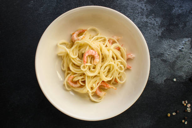istock pasta shrimp (spaghetti cream sauce and seafood prawn) menu concept. food background. top view. copy space 1192650373