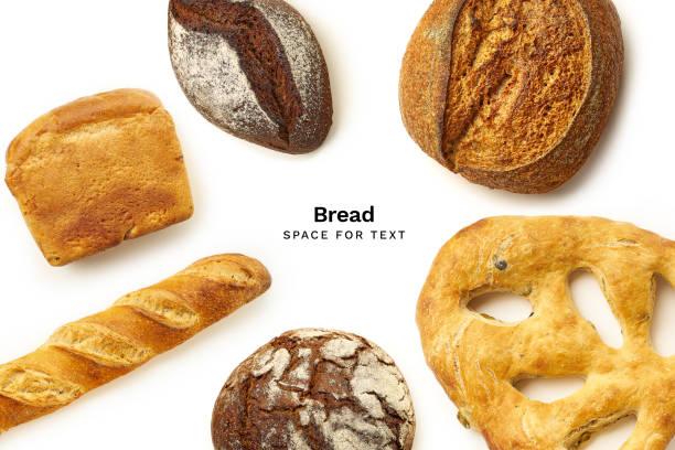 istock Bread of various types and shapes. Creative flatlay with copy space isolated on white background 1192651349