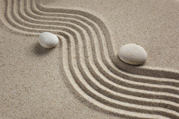 istock zen garden stones in light sand for relaxation and concentration during meditation 1192652563