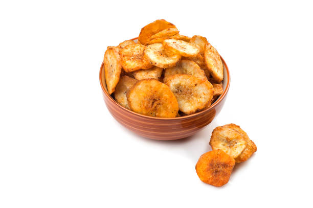 istock Banana chips on a white background 1192652605