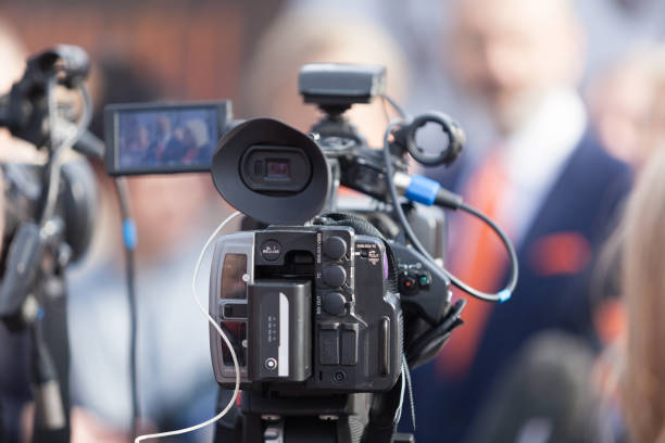 istock Filming news or press conference with a video camera 1192652829