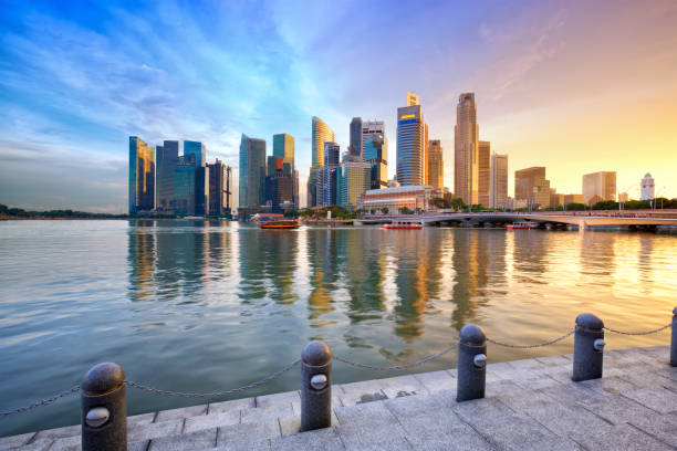 istock Singapore skyline at sunset 1192653070