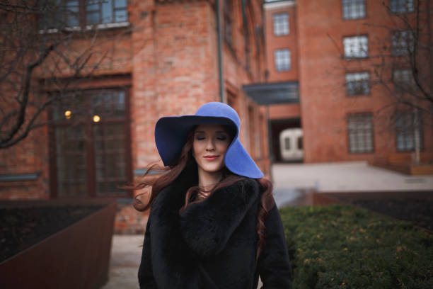 istock Beautiful charming young woman in a blue hat. 1192654149