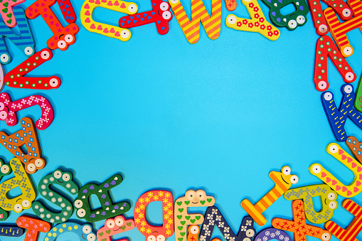 Multi colored alphabets frame background