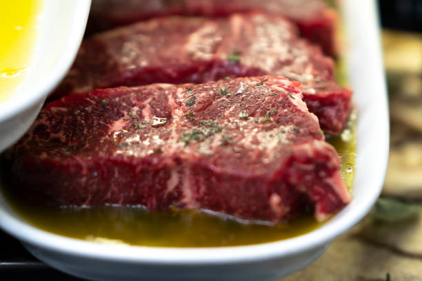 A display of gourmet raw Italian meat with olive oil and spices