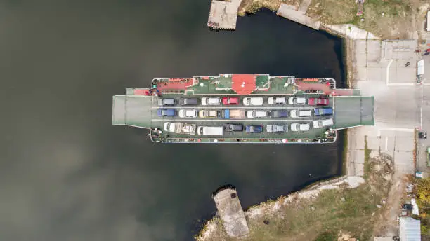 top down view of ferryboat. Ferryboat transferring cars. Ferry transfers cars and passengers to the other side