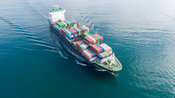 istock Large container ship at sea. Aerial top view of cargo container ship vessel import export container sailing. 1192657111