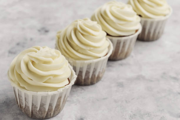 istock cute little cupcakes decorated with butter cream 1192658118