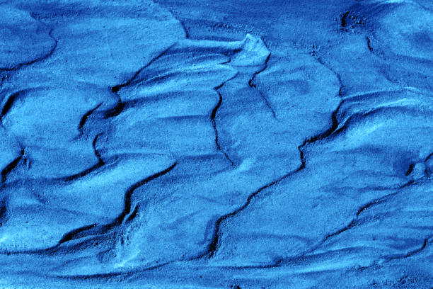 abstract background texture of wet sand and clay toned