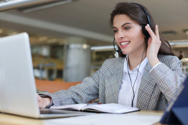 istock Woman customer support operator with headset and smiling. 1192659750