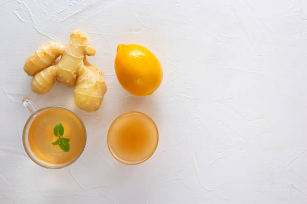 istock Tea with ginger, mint, lemon and honey on a white wooden table. 1192659847