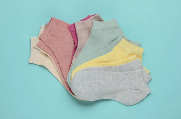 istock Set of pastel color socks on blue background. Top view 1192661049