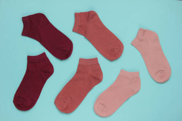istock Set of colored socks on blue background. Top view 1192661096