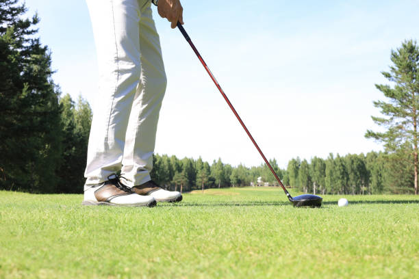 istock Golf approach shot with iron from fairway at sunny day. 1192661290