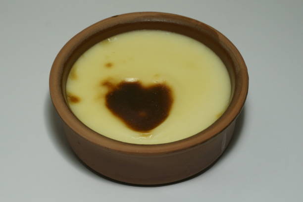 istock Baked rice pudding in ceramic bowl with heart shaped crust 1192662235