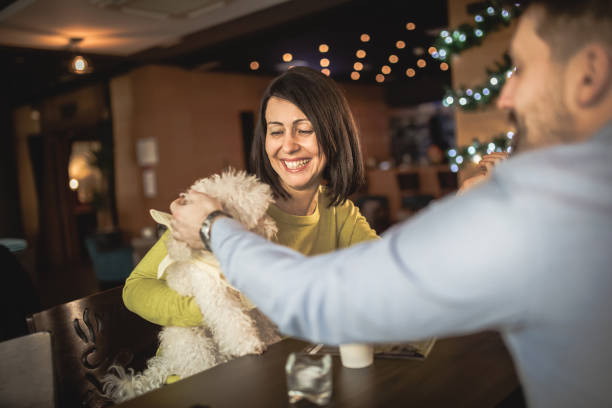 istock Friends relaxing around a table at a coffee shop 1192662773