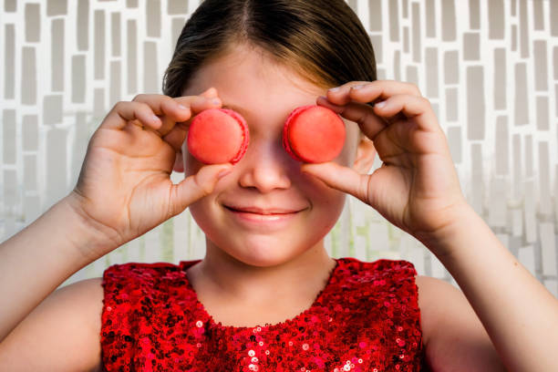 istock beautiful girl with macaroons in her hands 1192662866