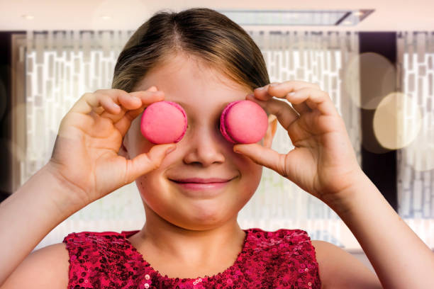 istock beautiful girl with macaroons in her hands 1192662908