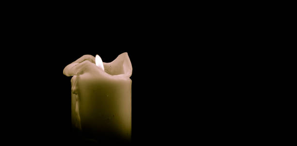 istock Candle flame close up on a black background 1192664295