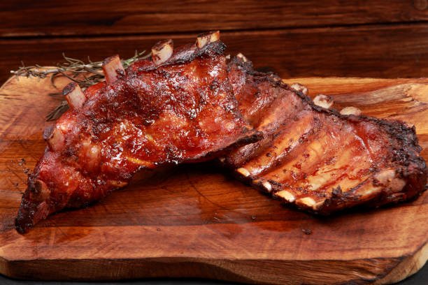 istock Marinated Grilled Baby Back Ribs on wooden platter 1192665221