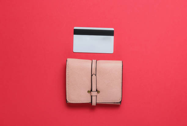 istock Wallet and bank card on red background. Top view 1192666286