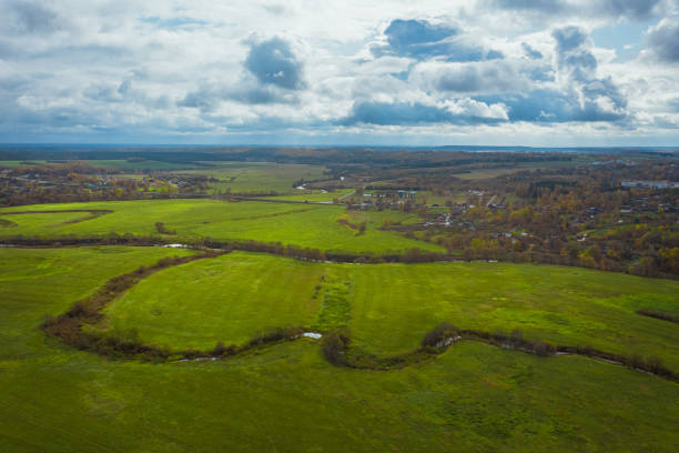 istock Picturesque flat autumn landscape with green fields. Drone view 1192666817