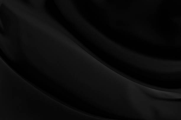 istock Black gray satin dark fabric texture luxurious shiny that is abstract silk cloth background with patterns soft waves blur beautiful. 1192667713