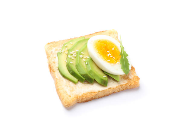 istock Toast with avocado and egg isolated on white background 1192667811