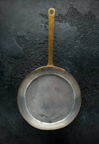 istock french Vintage Copper saute pans, kitchen utensil on dark background 1192669016
