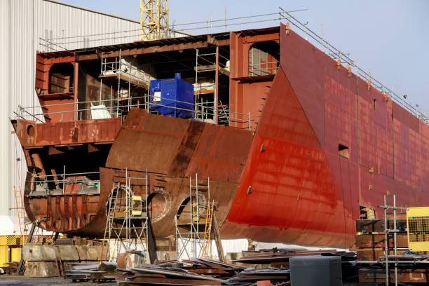 istock Ship building yard at shipbuilding construction dock with scaffolding in progress 1192669180