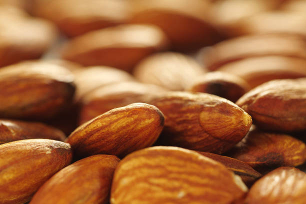 istock almond nut background, Close-up of almonds 1192669943