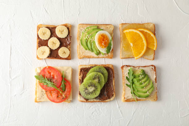 istock Flat lay with assorted sandwiches on white background, top view 1192670000