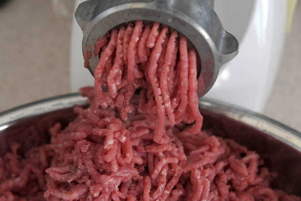 Background with fresh raw meat balls ready to be cooked.