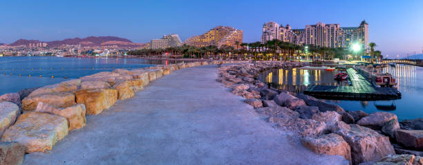 istock Night panoramic view from public walking pier on central beach and promenade of Eilat 1192673970