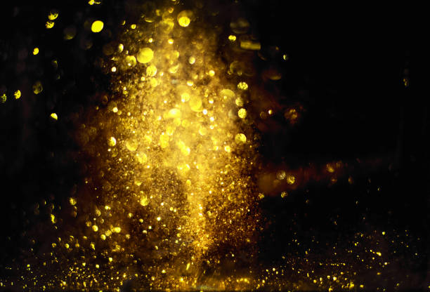istock golden glitter bokeh lighting texture Blurred abstract background for birthday, anniversary, wedding, new year eve or Christmas 1192675290