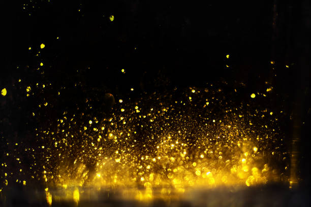 istock golden glitter bokeh lighting texture Blurred abstract background for birthday, anniversary, wedding, new year eve or Christmas 1192676136