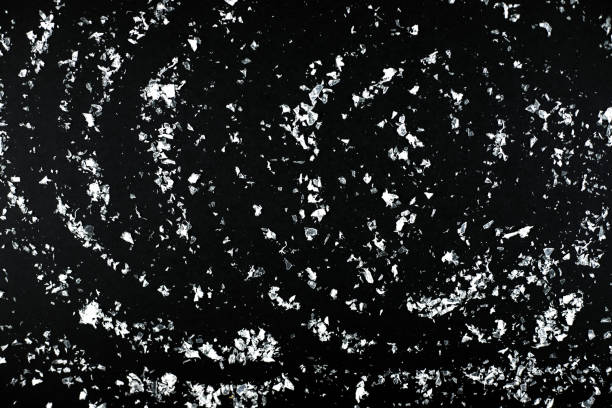 istock Snow overlay background isolated on black. 1192676345