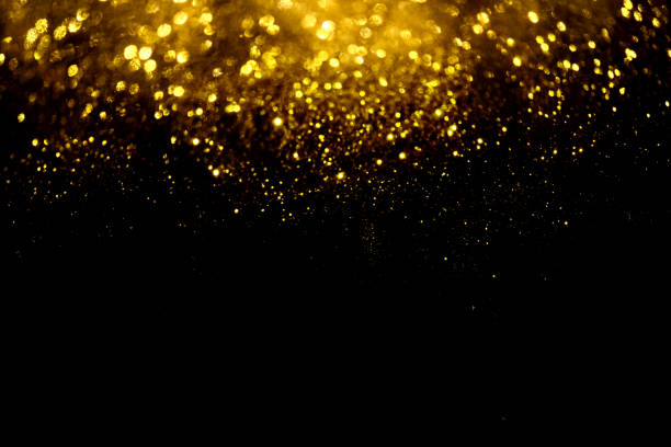 istock golden glitter bokeh lighting texture Blurred abstract background for birthday, anniversary, wedding, new year eve or Christmas 1192676604