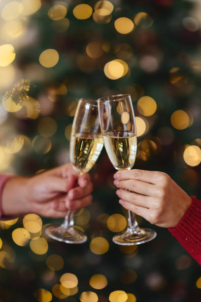 istock hands with full champagne glasses 1192677294