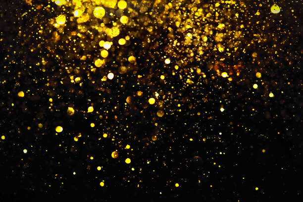 istock golden glitter bokeh lighting texture Blurred abstract background for birthday, anniversary, wedding, new year eve or Christmas 1192677309